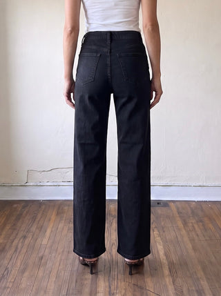 Women’s black denim jeans by JUST BLACK DENIM, showcasing a close-up of the dark, fitted denim fabric with subtle stitching details.