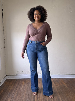 RISEN PBOT extended size comfort sculpt high-rise flare jeans shown on a model, featuring a flattering fit and stylish design.