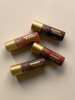Poppy & Pout Lip Tint gift set showing vibrant lip tint bottles and packaging on a white background.