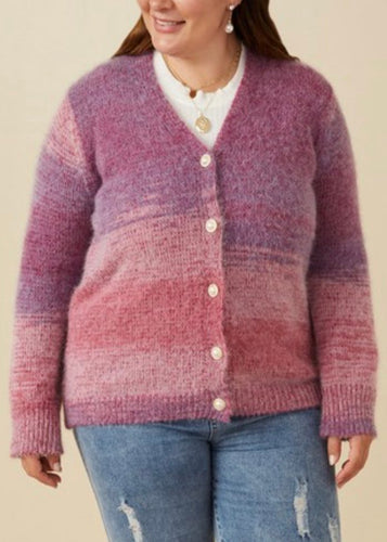 Chic and shimmering, the Purple Lurex Statement Button Cropped Cardigan adds a touch of glam to your wardrobe. Made from soft lurex knit fabric, it features a flattering cropped fit, cuffed sleeves, and eye-catching statement buttons for a polished finish.