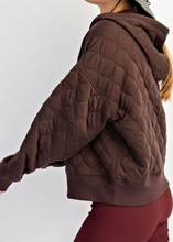 Load image into Gallery viewer, Person wearing a brown quilted jacket and maroon shorts on a white background
