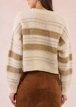 Load image into Gallery viewer, Person wearing a striped sweater with a plain background
