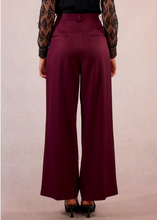Load image into Gallery viewer, Maroon wide-leg pants worn by a person on a plain background
