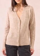 Load image into Gallery viewer, Person wearing a beige cardigan with a plain background
