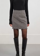 Load image into Gallery viewer, Person wearing a black turtleneck, gray patterned skirt, and black knee-high boots on a white background
