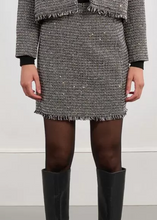 Load image into Gallery viewer, Person wearing a tweed skirt and black knee-high boots on a plain background
