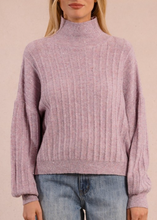 Load image into Gallery viewer, Person wearing a pink ribbed sweater and jeans on a beige background
