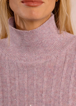 Load image into Gallery viewer, Close-up of a person wearing a pink knitted sweater with a high collar.
