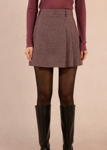Load image into Gallery viewer, Person wearing a patterned skirt, maroon sweater, brown tights, and black knee-high boots on a beige background
