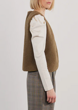 Load image into Gallery viewer, Person wearing a brown vest over a white long-sleeve shirt and plaid pants on a white background
