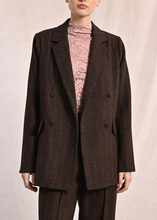 Load image into Gallery viewer, Woman wearing a brown suit with a pink turtleneck against a plain background

