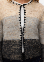 Load image into Gallery viewer, Close-up of a striped sweater with a zipper
