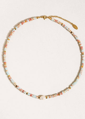 Beaded necklace with a gold clasp on a white background