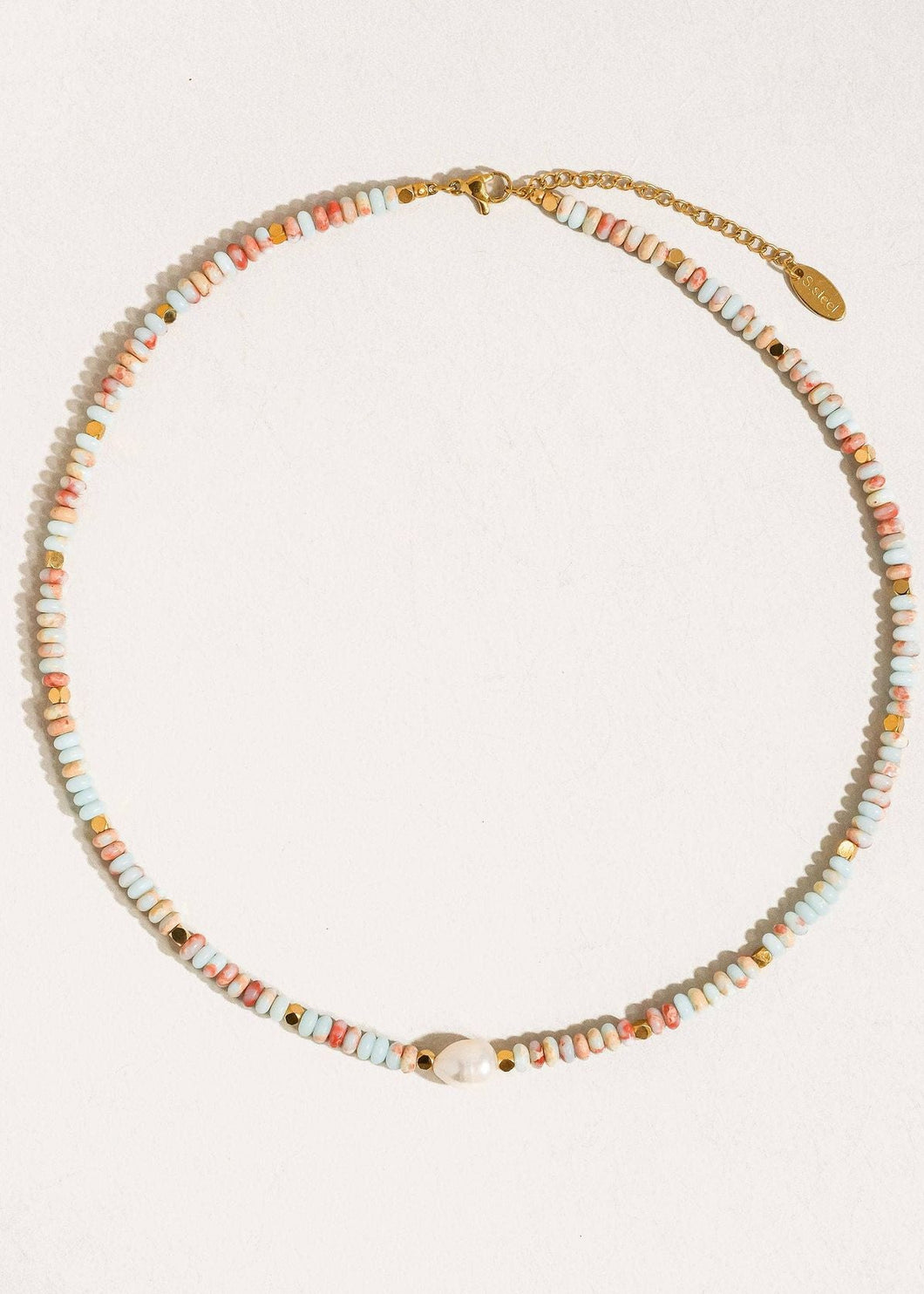 Beaded necklace with a gold clasp on a white background