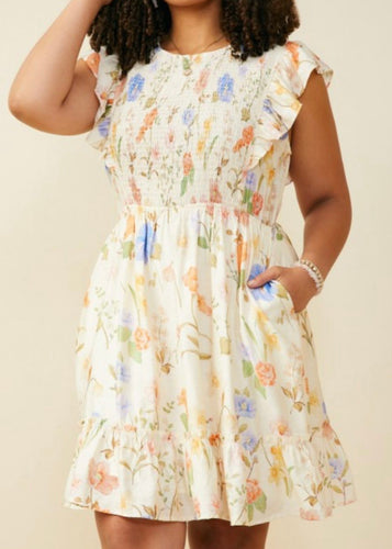 Woman wearing a floral dress against a beige background