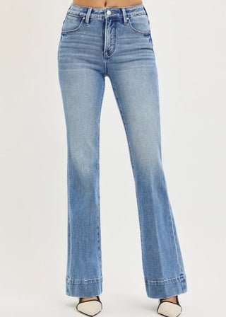 mild boot cut jean medium wash trouser cuff on white background 
