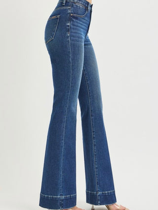 Risen Comfort Sculpt high-rise flare jeans in denim, showcasing fitted waist and flared leg style on a model.