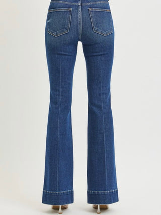 Risen Comfort Sculpt high-rise flare jeans in dark denim with a fitted waist and flared leg design, showcasing front and back views.