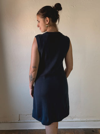 SHE + SKY Modern Muse sleeveless sweater dress in DMIN style, featuring a fitted, stylish design perfect for casual or office wear.