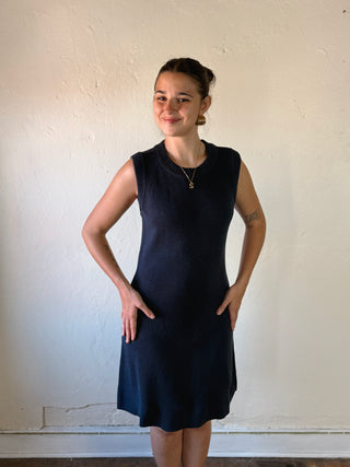 She + Sky Modern Muse sleeveless sweater dress in DMIN style, featuring a fitted, stylish knit design.